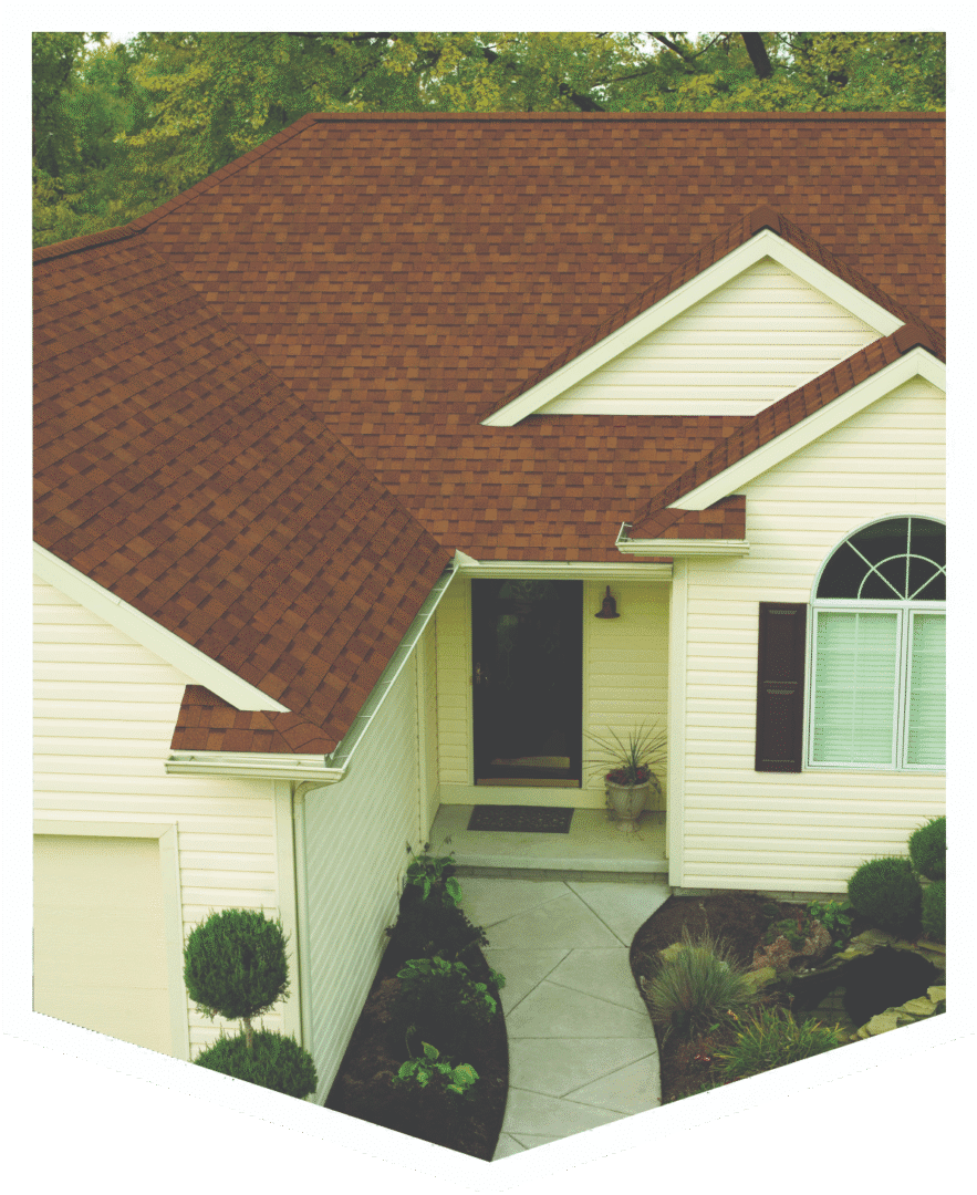 A house entrance with a brown roof and white siding.