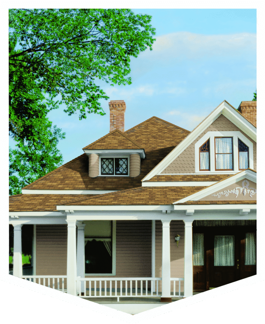 A charming house with a porch and tree.