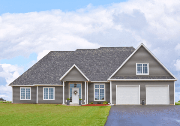 Modern gray suburban house with two-car garage.